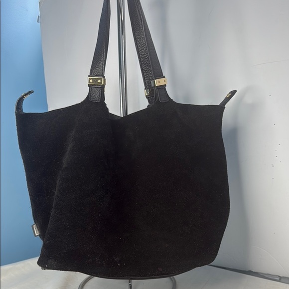 The image shows a Michael Kors Colgate Reversible Grab Bag in black. - Picture 10 of 11